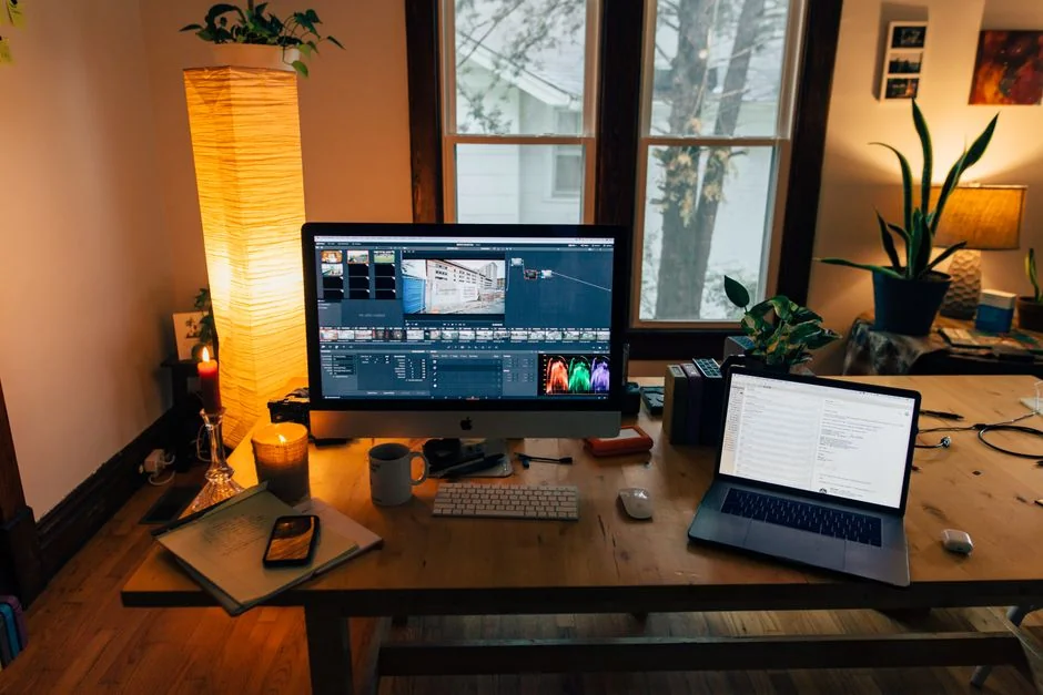 team-01 A clean and modern workspace featuring a laptop, tablet, smartphone, and monitor. Ideal for remote work and tech setups.